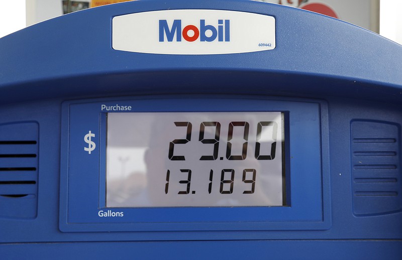 FILE - In this June 26, 2019, file photo a Mobil gas pump displays the various types of fuel and their prices at this Flowood, Miss., station. Exxon Mobil Corp. reports financial results Friday, Nov. 1. (AP Photo/Rogelio V. Solis, File)