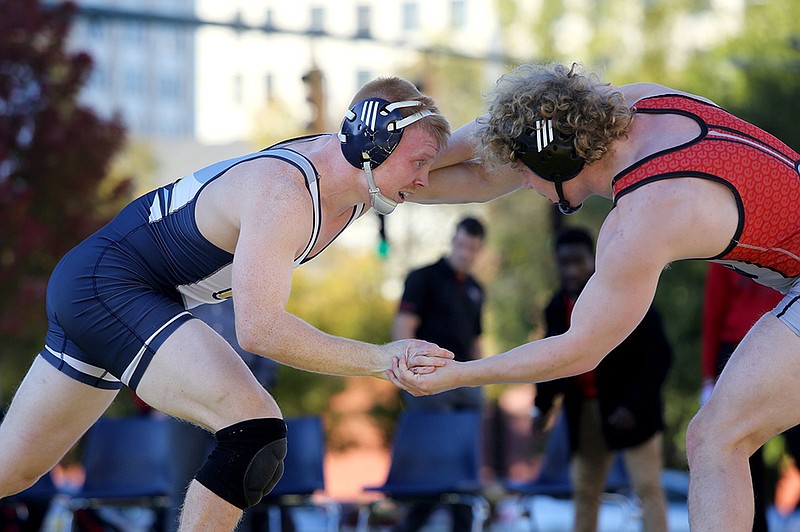 Staff file photo / UTC's Drew Nicholson, left, fights for hand control with SIU-Edwardsville's Chase Diehl in their 165-pound match Nov. 1 at Miller Park. Nicholson won 8-2 that day, and he earned a 6-5 victory against 26th-ranked Dazjon Casto on Sunday in Charleston, S.C., as the Mocs beat The Citadel 39-9.