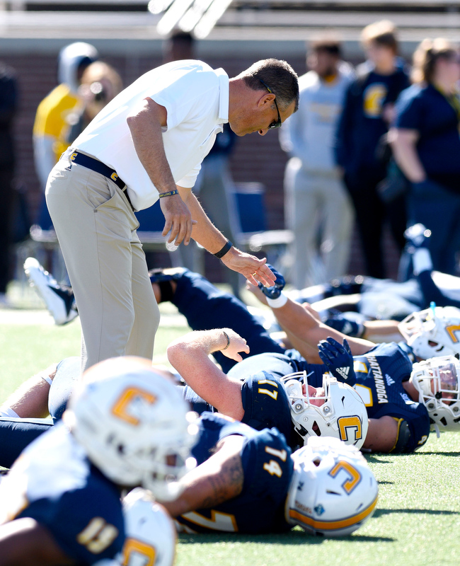 Staff Photo by Robin Rudd/ Head coach Rusty Wright encourages his Mocs during warmups before the game. The University of Tennessee at Chattanooga Mocs hosted the Furman Paladins in a Southern Conference football game at Finley Stadium on November 2, 2019.