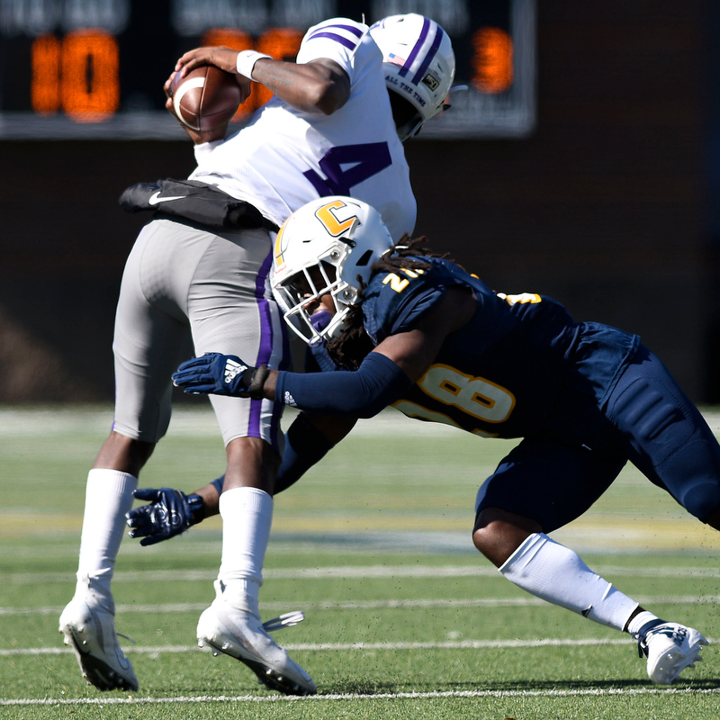 Staff Photo by Robin Rudd/ UTC's Adrian King (28) tackles Furman's Darren Grainger (4). The University of Tennessee at Chattanooga Mocs hosted the Furman Paladins in a Southern Conference football game at Finley Stadium on November 2, 2019.