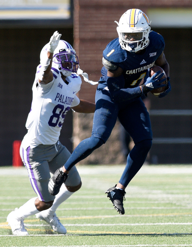 Staff Photo by Robin Rudd/ UTC's Brandon Dowdell (1) comes up with a interception in front of Furman's Thomas Gordan (89). The University of Tennessee at Chattanooga Mocs hosted the Furman Paladins in a Southern Conference football game at Finley Stadium on November 2, 2019.