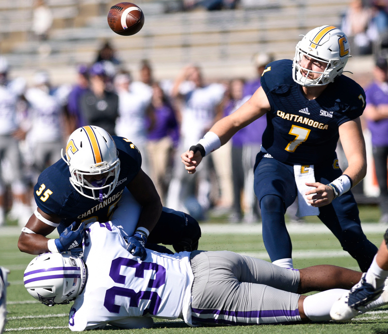 Staff Photo by Robin Rudd/ UTC's Ailym Ford (32) fumbles the ball has he is hits by Furman's Josh Agbenou (33). Nick Tiano (7) goes after the ball but it was recovered by Furman. The University of Tennessee at Chattanooga Mocs hosted the Furman Paladins in a Southern Conference football game at Finley Stadium on November 2, 2019.