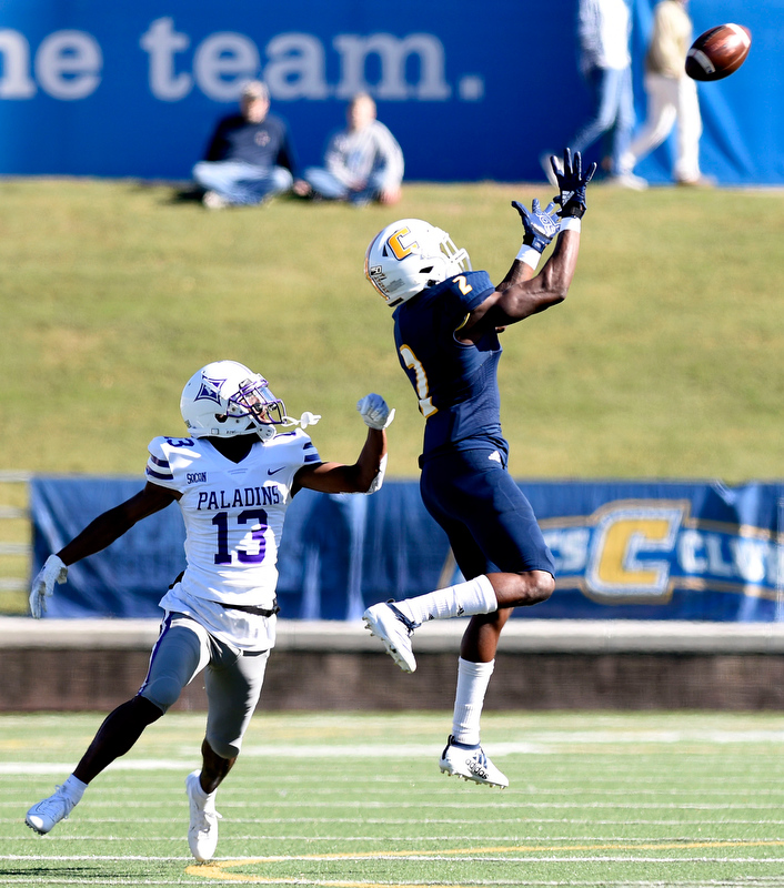 Staff Photo by Robin Rudd/ UTC's Kanore McKinnon (2) catches a pass in front of Furman's Quandarius Weems (13). The University of Tennessee at Chattanooga Mocs hosted the Furman Paladins in a Southern Conference football game at Finley Stadium on November 2, 2019.