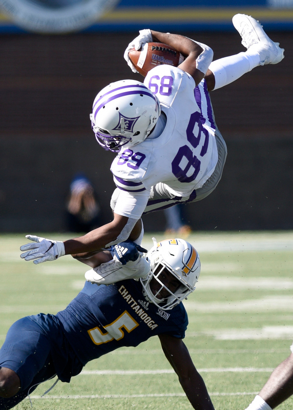 Staff Photo by Robin Rudd/ UTC's CaMiron Smith (5) upends Furman's Thomas Gordon (89). The University of Tennessee at Chattanooga Mocs hosted the Furman Paladins in a Southern Conference football game at Finley Stadium on November 2, 2019.