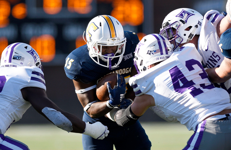 Staff Photo by Robin Rudd/ The Furman defense closes in on UTC's Jonathan Stovall (35). The University of Tennessee at Chattanooga Mocs hosted the Furman Paladins in a Southern Conference football game at Finley Stadium on November 2, 2019.