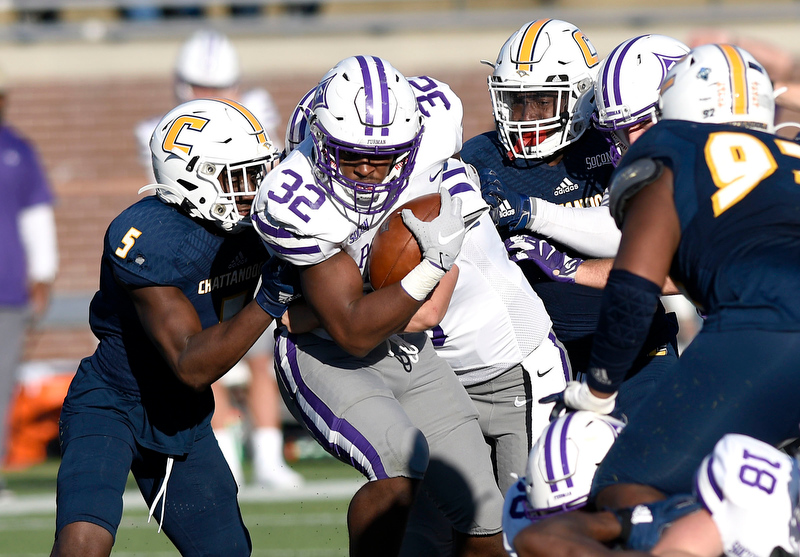 Staff Photo by Robin Rudd/ Furman's Devin Abrams (32) breaks through the heart of the Moc defense to score a touchdown late in the game. The final score was 35 to 20. The University of Tennessee at Chattanooga Mocs hosted the Furman Paladins in a Southern Conference football game at Finley Stadium on November 2, 2019.