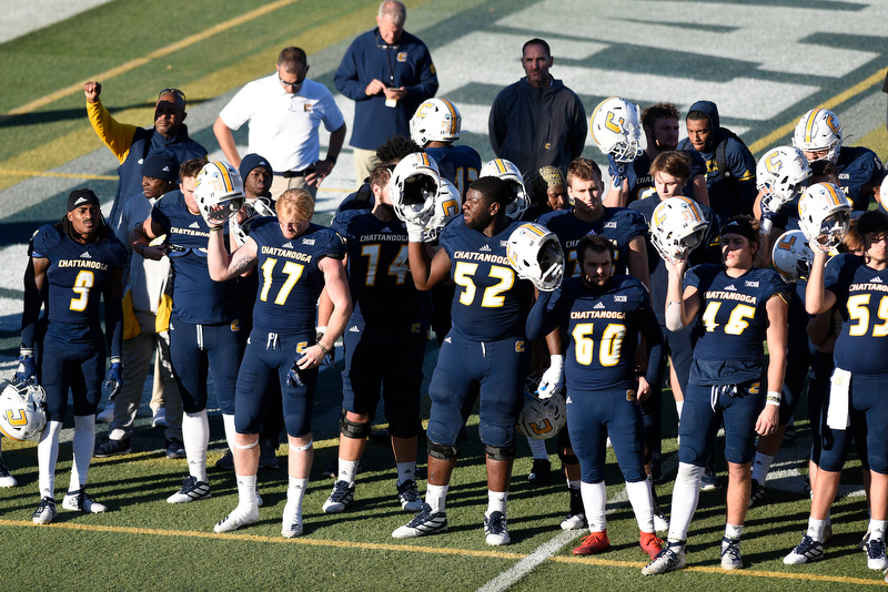 Staff Photo by Robin Rudd/ The Mocs held up their helmets as the band plays the Alma Mater. The Mocs lost 35 to 20. The University of Tennessee at Chattanooga Mocs hosted the Furman Paladins in a Southern Conference football game at Finley Stadium on November 2, 2019.