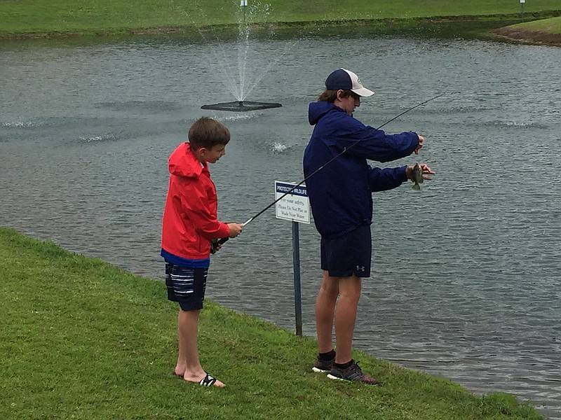 Brothers enjoy a fishing outing. Photo by Mark Kennedy