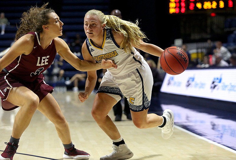 Staff photo by Erin O. Smith / UTC senior guard Lakelyn Bouldin, right, tries to drive past Lee's Taylor Boggess and toward the basket during an exhibition game this past Tuesday night at McKenzie Arena.