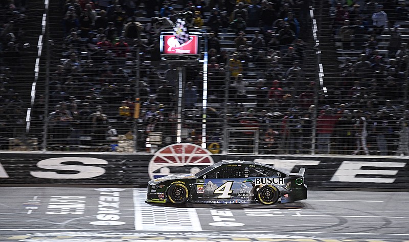 AP photo by Larry Papke / Kevin Harvick crosses the finish line to win Sunday's NASCAR Cup Series race at Texas Motor Speedway.