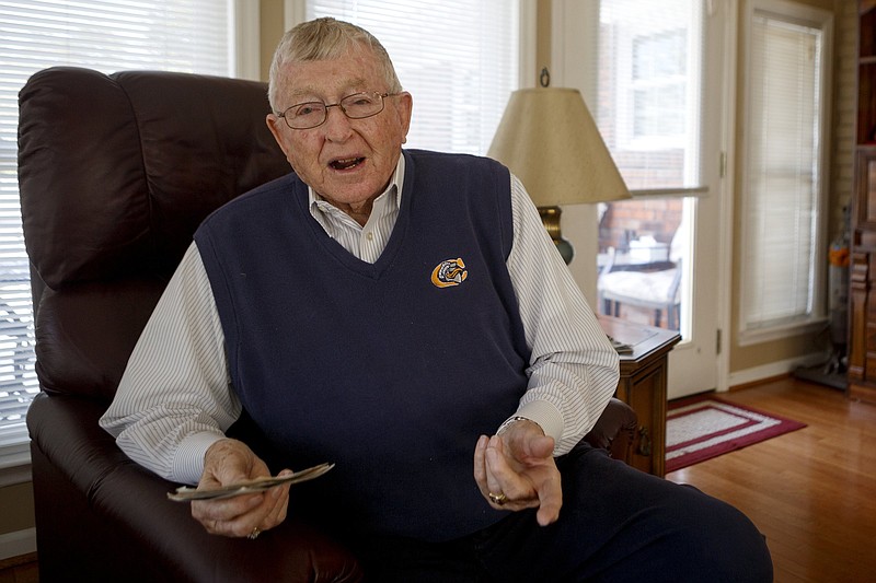 Staff photo by C.B. Schmelter / Veteran Jim Gutshall talks while going through photos from his time in the military at his home on Friday, Oct. 18, 2019 in Chattanooga, Tenn.