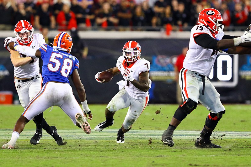 Georgia photo by Tony Walsh / Georgia controlled the ball for nearly 36 minutes during Saturday's 24-17 downing of Florida, with junior tailback D'Andre Swift rushing 25 times for 86 hard-earned yards.