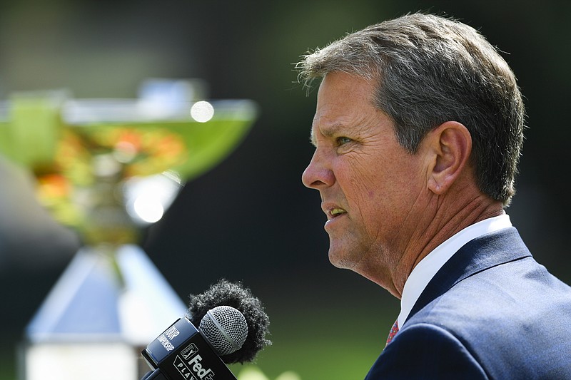 In this Thursday, Aug. 22, 2019 file photo, Georgia Governor Brian Kemp welcomes the Tour Championship golf tournament back to Atlanta before the first round, in Atlanta. Kemp plans to seek federal approval for a limited expansion of Medicaid that would require new enrollees to work, volunteer, receive job training or attend school. Kemp unveiled the plan on Monday, Nov. 4, 2019. (AP Photo/John Amis, File)