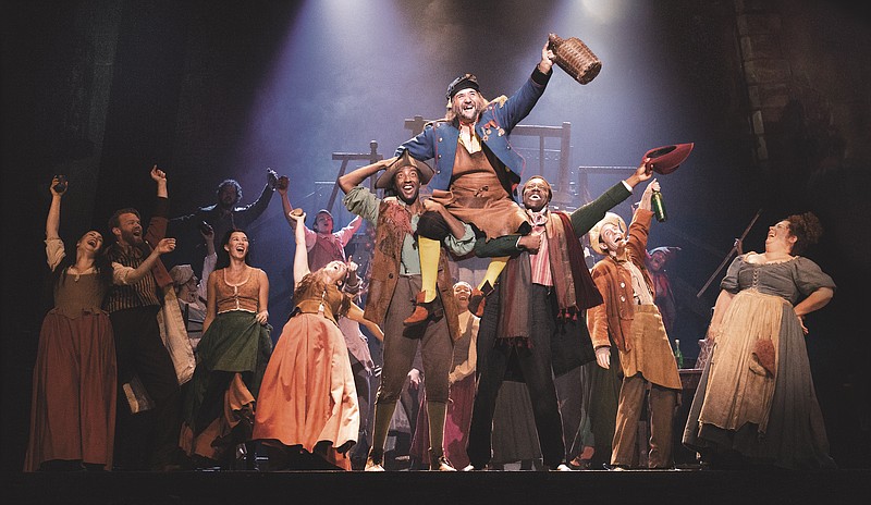 The company of "Les Miserables" performing "Master of the House," in which the Thenardiers (Jimmy Smagula, being lifted into the air, and Allison Guinn, far right) sing about their lives of criminal wickedness. / Photo by Evan Zimmerman