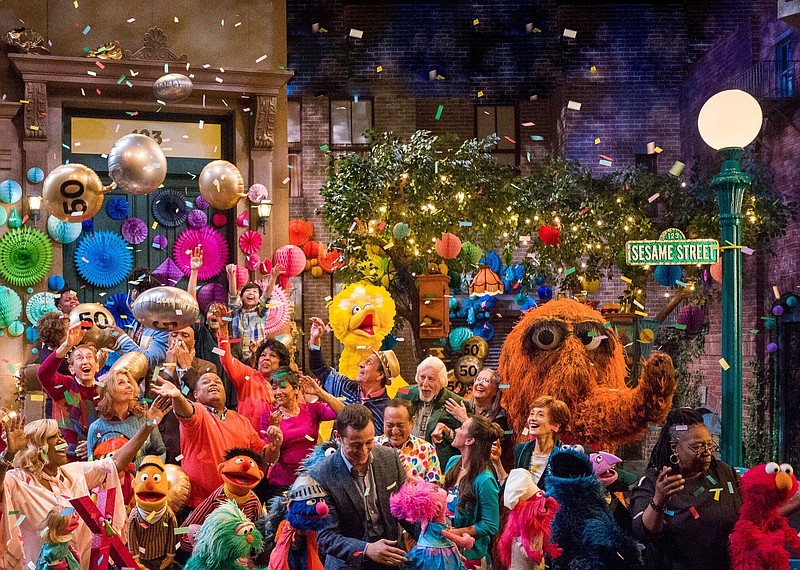 This image released by HBO shows the cast of "Sesame Street" during a celebration of their 50th season of the popular children's TV show. This first episode of "Sesame Street" aired in the fall of 1969. (Richard Termine/HBO via AP)
