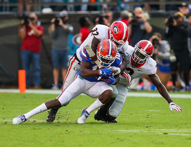 Georgia photo/Chamberlain Smith / Georgia inside linebacker Monty Rice (32) and safety Richard LeCounte (2) have helped the Bulldogs rank among the top defensive teams nationally, but that has not translated into a lot of turnovers.