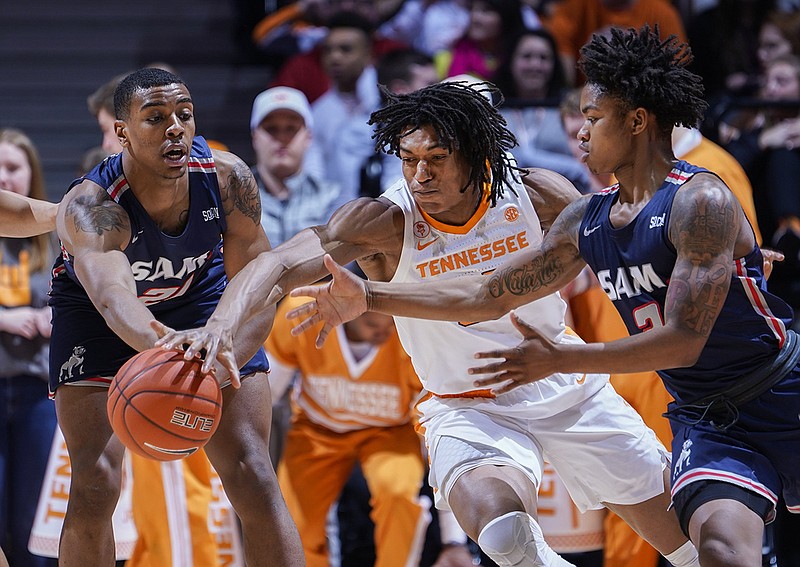 File photo by Patrick Murphy-Racey / One game into his junior season at Tennessee, Yves Pons, center, has shown he has more options when it comes to shooting.