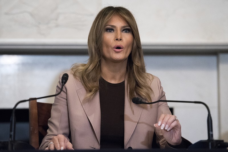 FILE - In this Wednesday, Oct. 23, 2019 file photo first lady Melania Trump participates in a roundtable discussion on the opioid crisis, on Capitol Hill in Washington. The first lady is to make a planned stop Wednesday, Nov. 6, 2019, at Boston Medical Center, in Boston, as part of her "Be Best" initiative. (AP Photo/Cliff Owen, File)