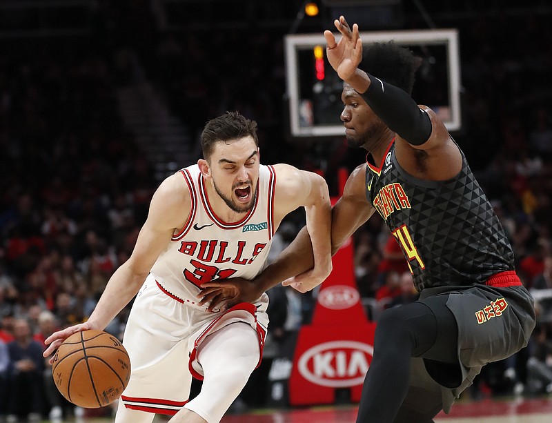 AP photo by John Bazemore / Chicago Bulls guard Tomas Satoransky drives against Atlanta Hawks forward Bruno Fernando during the first half of Wednesday night's game in Chicago.