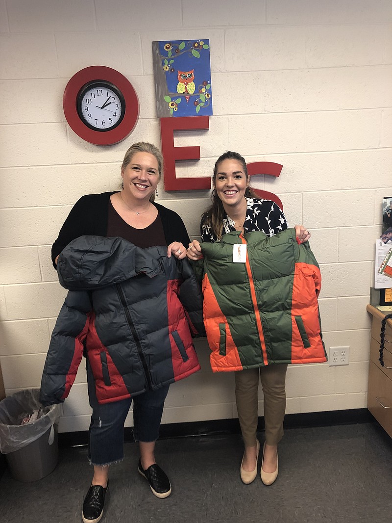 Contributed photo / Delivering coats to Ooltewah Elementary School are Tiffany Commons, at left, Hamilton Place Rotary Club board member, and Bethanie Reynolds, assistant principal at Ooltewah Elementary School.
