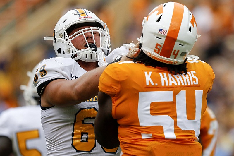 Staff photo by C.B. Schmelter / UTC offensive lineman Cole Strange works against Tennessee defensive lineman Kingston Harris during their teams' Sept. 14 game in Knoxville.