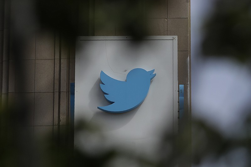 This July 9, 2019, file photo shows a sign outside of the Twitter office building in San Francisco. The Saudi government recruited two Twitter employees to get personal account information of their critics, prosecutors said Wednesday, Nov. 6, 2019. (AP Photo/Jeff Chiu, File)