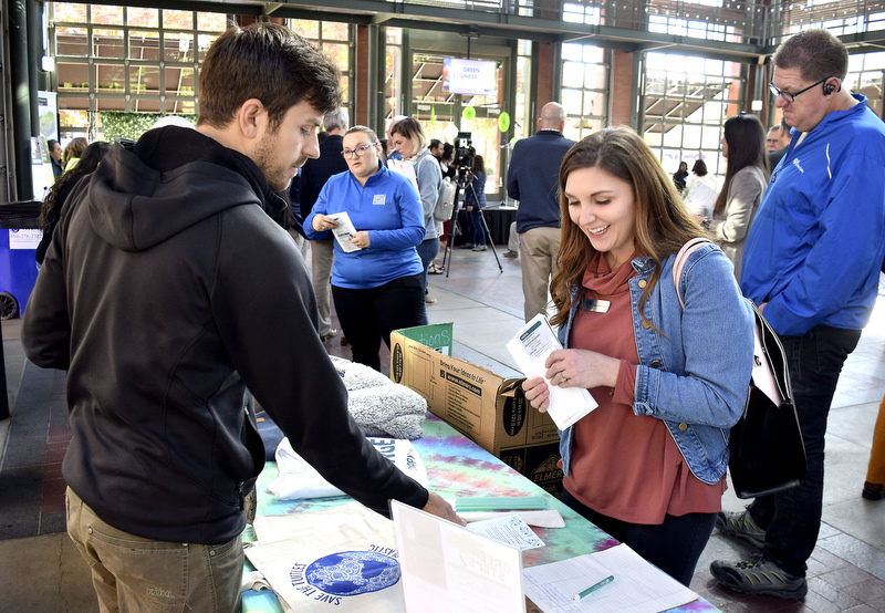 Staff Photo by Robin Rudd/ Jimmy Urciuoli, of Green Steps, talks with Jessica Bastianelli of the United Way. During the EPB Green Expo, at Miller Plaza's Waterhouse Pavilion, it was announced that the EPB building will be one of the first LEED Gold buildings in Chattanooga. The Expo took place on November 8, 2019.