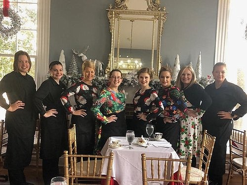 Polly Claire's contributed photo / The staff at Polly Claire's gathers for a holiday photo. Staffers are dressing in full Colonial era period costumes for the tea room's Christmas Feast, held
