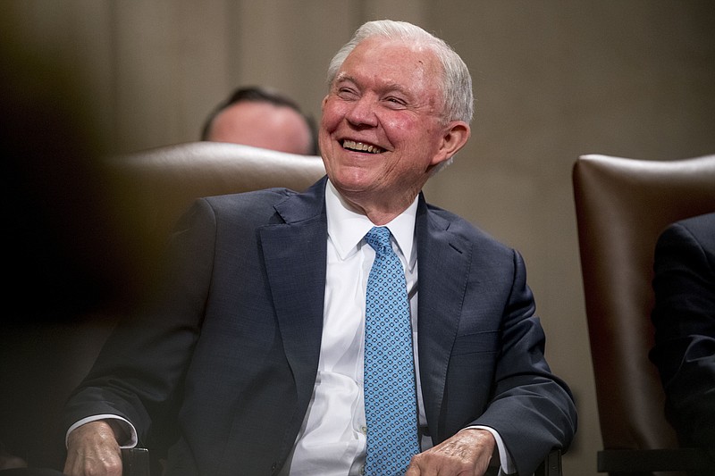 In this May 9, 2109, file photo, former Attorney General Jeff Sessions smiles during a farewell ceremony for Deputy Attorney General Rod Rosenstein in the Great Hall at the Department of Justice in Washington. Sessions is planning to run for his former Senate seat in Alabama. (AP Photo/Andrew Harnik, File)