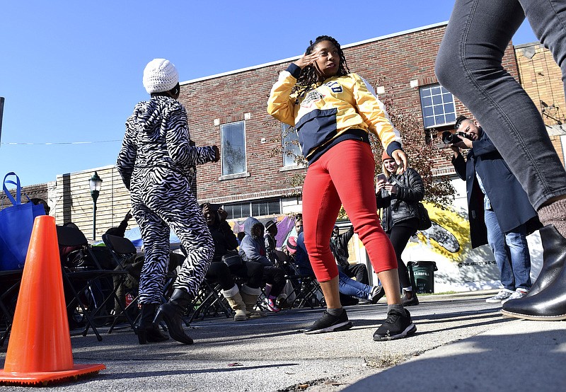 Staff Photo by Robin Rudd/   Festival goers break into dancing on the street.  Glass Street Live, now in it's seventh year, was held on block of Glass Street between North Chamberlain Ave, and Wheeler Ave. on November 9, 2019.  