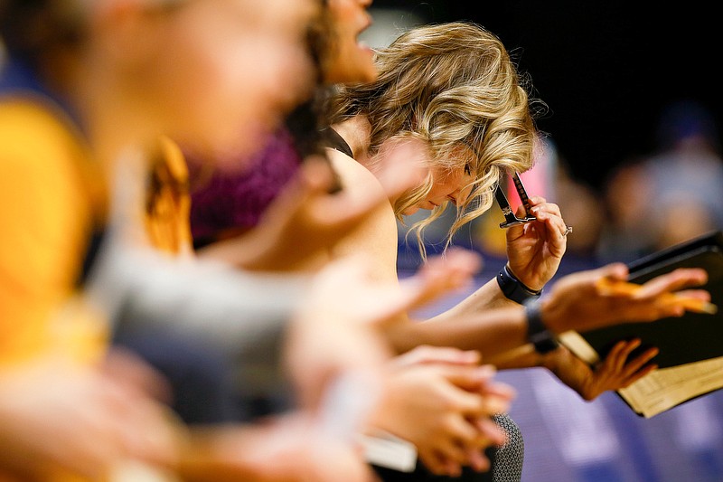 Staff photo by C.B. Schmelter / UTC women's basketball coach Katie Burrows takes off her glasses at the end of the first half during the Mocs' home game against Hampton on Nov. 9, 2019.