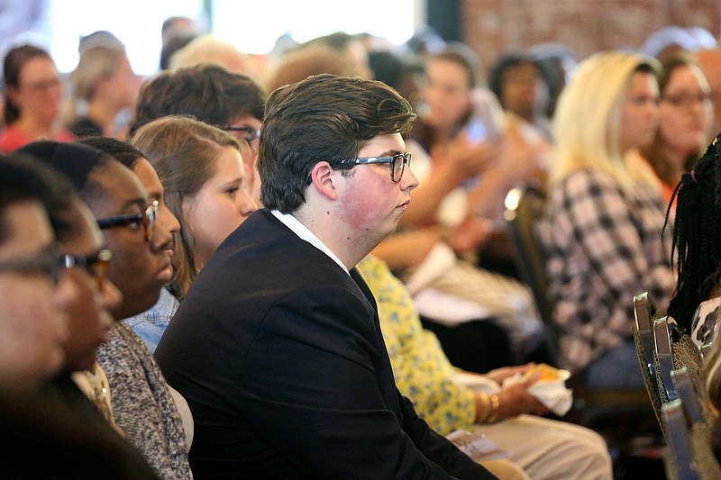 Noah Risley, a junior at McCallie School, listens to speakers during the Cap, Gown, Vote - Mayor's Youth Council Edition event at Bessie Smith Cultural Center Wednesday, August 29, 2018 in Chattanooga, Tennessee. Noah is one of the 36 students on the Mayor's Youth Council.