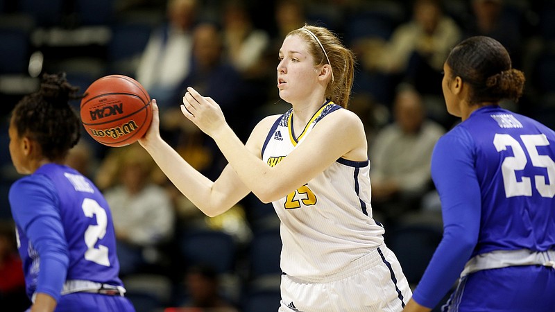 UTC forward Abbey Cornelius passes during a home game against Hampton on Nov. 9. In a 78-51 loss Sunday at UT-Martin, Cornelius finished with 11 points and 11 rebounds for the first double-double of her UTC career. / Staff photo by C.B. Schmelter