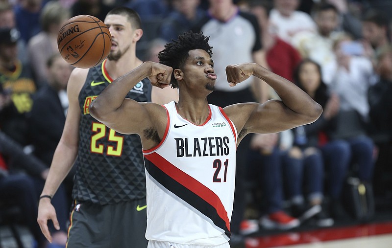 AP photo by Craig Mitchelldyer / Portland Trail Blazers center Hassan Whiteside flexes while celebrating a basket during Sunday's home game against the Atlanta Hawks.