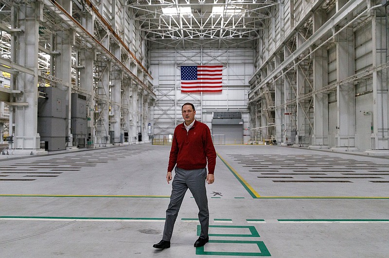 Staff file photo / Jimmy White of West End Property, walks through a building in the Alstom site that is slated for use as manufacturing. Developers plan to turn almost all of the rest of the site into a new mixed-use development.