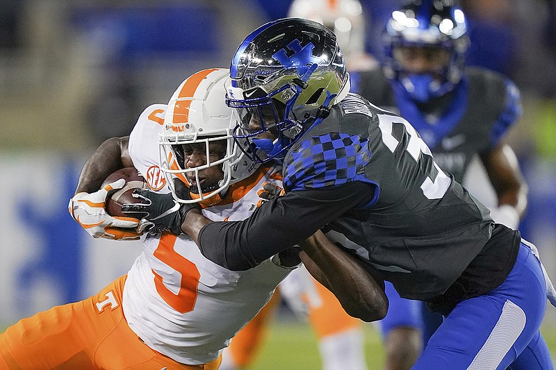 AP photo by Bryan Woolston / Tennessee wide receiver Josh Palmer tries to fend off Kentucky defensive back Jamari Brown during the first half of Saturday night's SEC East matchup in Lexington, Ky.