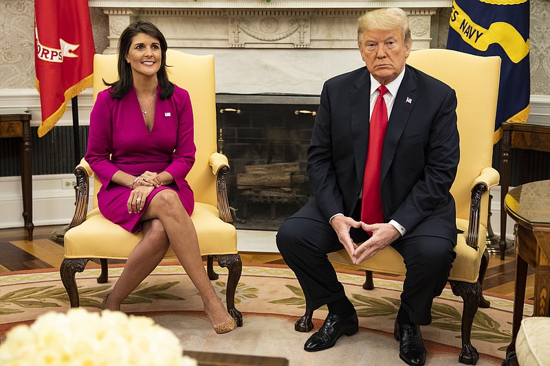 File photo bty Samuel Corum of The New York Times / Nikki Haley, the U.S. ambassador to the United Nations, with President Donald Trump at her resignation in the Oval Office of the White House in Washington, on Oct. 9, 2018. The former ambassador to the United Nations says in a new book that John Kelly and Rex Tillerson sought to enlist her in circumventing President Trump's policies.