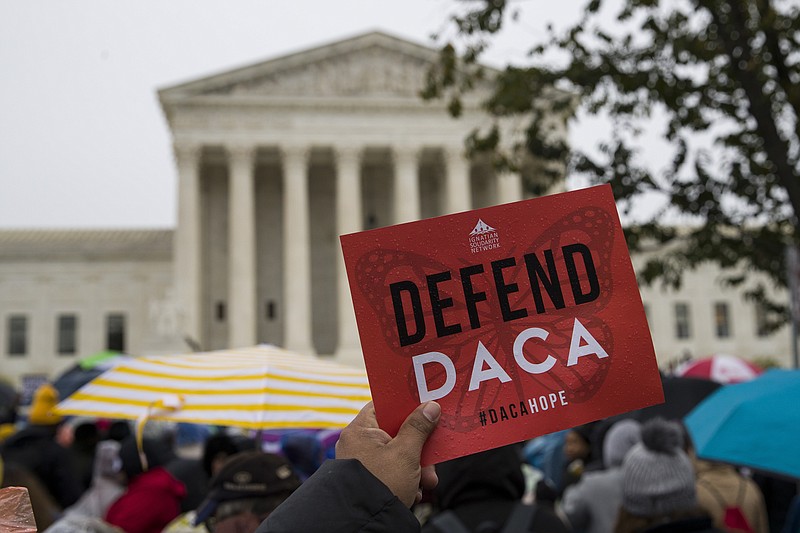 People rally outside the Supreme Court as oral arguments are heard in the case of President Trump's decision to end the Obama-era, Deferred Action for Childhood Arrivals program (DACA), Tuesday, Nov. 12, 2019, at the Supreme Court in Washington. (AP Photo/Alex Brandon)


