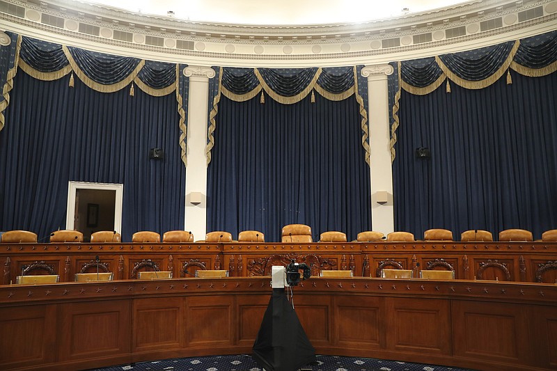 The dais in the hearing room where the House will begin public impeachment inquiry hearings Wednesday, is seen on Tuesday, Nov. 12, 2019, on Capitol Hill in Washington. With the bang of a gavel, House Intelligence Committee Chairman Adam Schiff will open the hearings into President Donald Trump's pressure on Ukraine to investigate Democratic rival Joe Biden's family. (AP Photo/Jacquelyn Martin)

