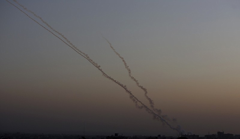 Rockets are launched from the Gaza Strip towards Israel, Wednesday, Nov. 13, 2019. Israeli airstrikes pounded Islamic Jihad group targets in Gaza and militants resumed rocket fire toward Israel after a brief overnight lull, raising the death toll to tens of Palestinians, including a 7-year-old boy and two other minors, in the heaviest round of fighting in months. (AP Photo/ Hatem Moussa)