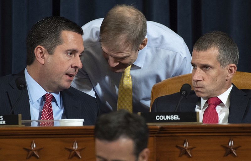 Ranking member Rep. Devin Nunes, R-Calif., left, confers with Rep. Jim Jordan, R-Ohio, as Steve Castor, Republican staff of the House Oversight Committee, right, looks on, as top U.S. diplomat in Ukraine William Taylor, and career Foreign Service officer George Kent, testify before the House Intelligence Committee on Capitol Hill in Washington, Wednesday, Nov. 13, 2019, during the first public impeachment hearing of President Donald Trump's efforts to tie U.S. aid for Ukraine to investigations of his political opponents. (Saul Loeb/Pool Photo via AP)