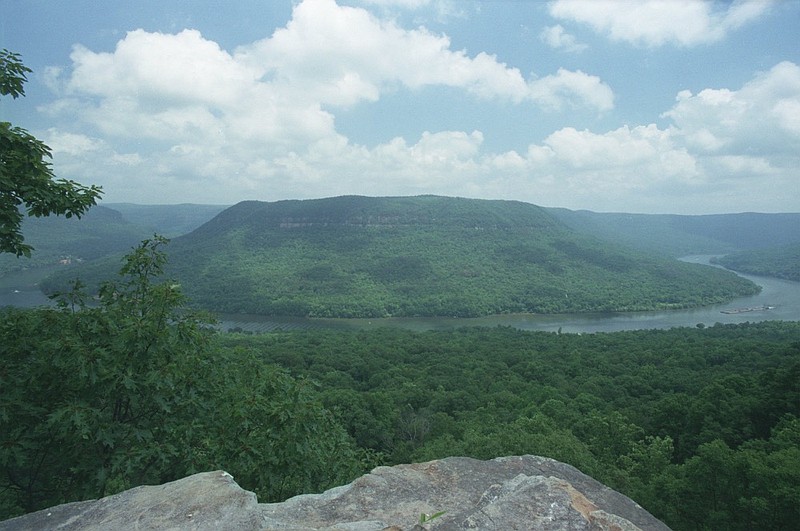 A lone barge, at right, winds its way through the Tennessee River Gorge recently. This magnificient view of the gorge is from Snooper's Rock in Prentice Cooper State Forest. / Staff Photo by Alex McMahan 