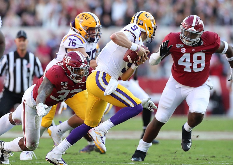 Alabama photo by Kent Gidley / Alabama outside linebacker Anfernee Jennings (33) and defensive lineman Phidarian Mathis (48) attempt to corral LSU quarterback Joe Burrow during last Saturday's 46-41 loss to the Tigers.