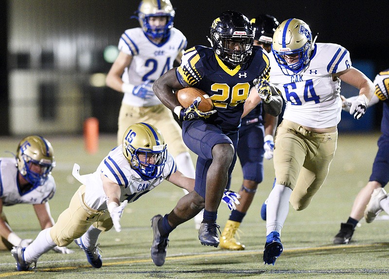 Staff Photo by Robin Rudd / Chattanooga Christian's Traveon Scott breaks through visiting Christian Academy of Knoxville's defense for a 70-yard dash and his second touchdown run of last Friday's home win for the Chargers in the first round of the TSSAA Division II-AA playoffs.
