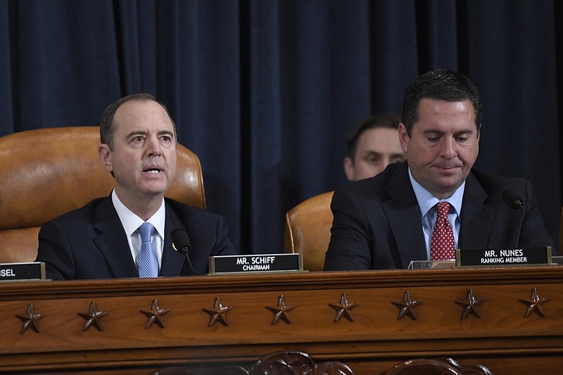 Susan Walsh, The Associated Press / House Intelligence Committee Chairman Adam Schiff of Calif., left, speaks as Rep. Devin Nunes, R-Calif., the ranking member on the committee listens Wednesday during the first day of public impeachment hearings on Capitol Hill. More hearings are scheduled today to examine President Donald Trump's efforts to tie U.S. aid for Ukraine to investigations of his political opponents.