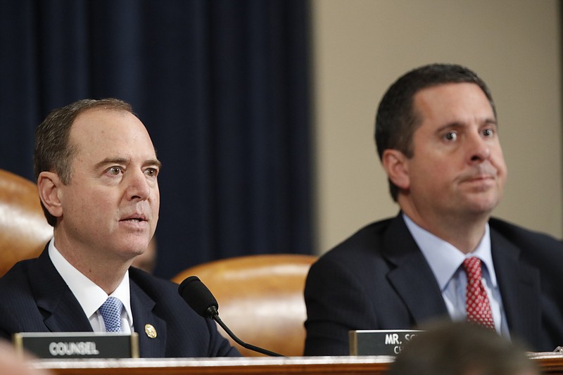 House Intelligence Committee Chairman Rep. Adam Schiff, D-Calif., left, and ranking member Rep. Devin Nunes, R-Calif., look on during a hearing of the House Intelligence Committee on Capitol Hill in Washington, Wednesday, Nov. 13, 2019, during the first public impeachment hearing of President Donald Trump's efforts to tie U.S. aid for Ukraine to investigations of his political opponents. (AP Photo/Alex Brandon)