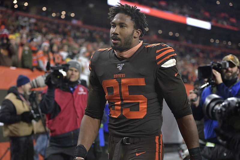 Cleveland Browns defensive end Myles Garrett walks off the field after he was ejected late in the fourth quarter of an NFL football game against the Pittsburgh Steelers, Thursday, Nov. 14, 2019, in Cleveland. The Browns won 21-7. (AP Photo/David Richard)