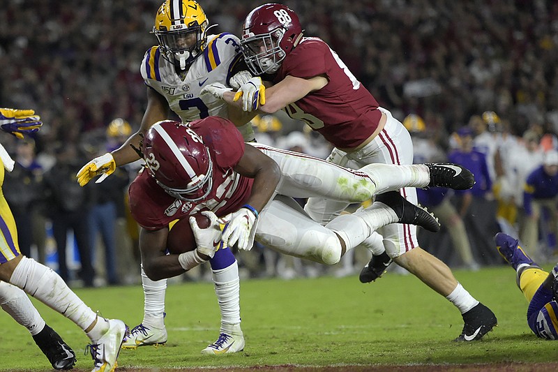 AP photo by Vasha Hunt / Alabama running back Najee Harris dives in for a touchdown during the second half of the Crimson Tide's home game against LSU last Saturday.