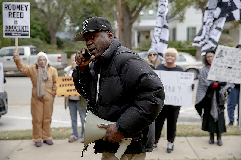 Rodrick Reed leads a chant during a protest against the execution of Rodney Reed on Wednesday, Nov. 13, 2019, in Bastrop, Texas. Reed is scheduled to be executed Nov. 20, but a growing number of politicians and celebrities have joined calls to further examine Reed's case before his execution proceeds. (Nick Wagner/Austin American-Statesman via AP)