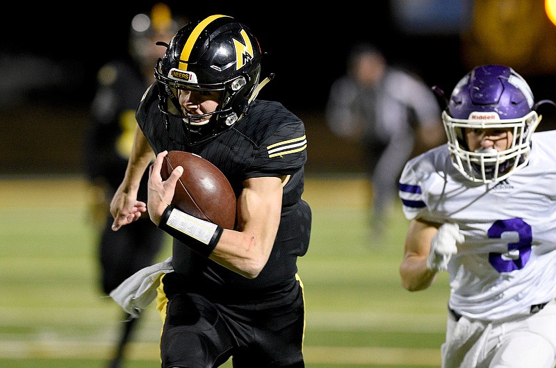 Staff Photo by Robin Rudd / North Murray's Ladd McConkey returns an interception for the Mountaineers' first touchdown of Friday night's GHSA Class AAA first-round playoff game against Monroe Area in Chatsworth, Ga.